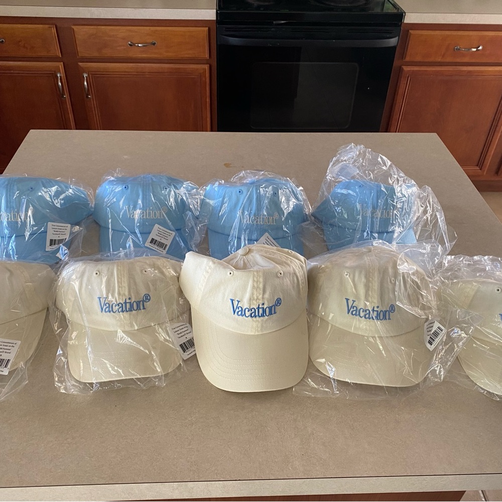 9 brand new adjustable Vacation brand hats.